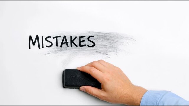 A person erasing mistakes on a whiteboard, a concept of correcting errors and learning