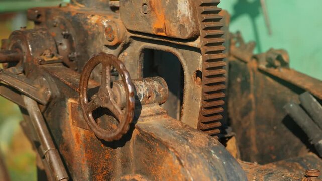 Obsolete, abandoned, and rusted combat units with aiming levers stand amidst the natural landscape. A graveyard of weaponry. An echo of war.