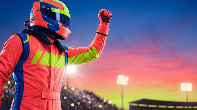 F1 driver celebrating championship victory with raised fist at sunset  