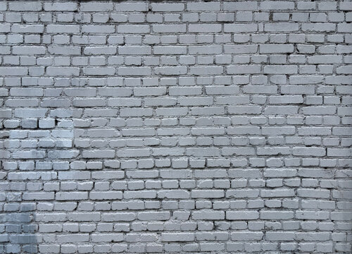 White brick wall texture. Old weathered brickwork background