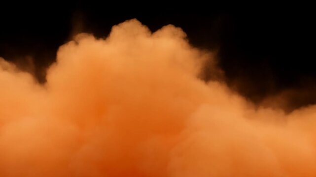 Orange explosion expands into a fiery smoke cloud against a deep black background