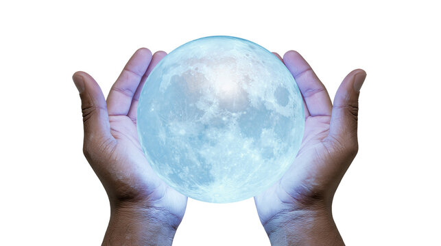 Isolated dark-skinned hands cupping a glowing full moon with light blue aura and soft light.