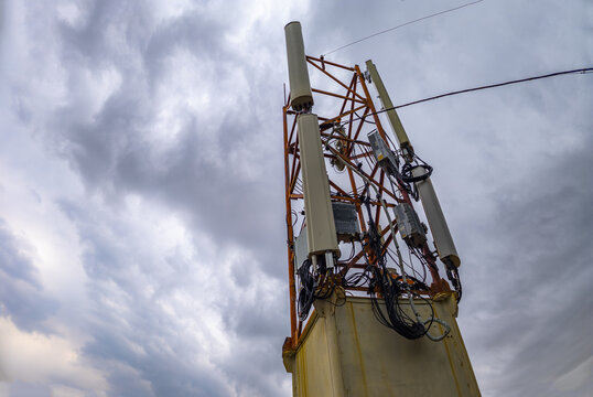 Telecommunications Tower Against Dramatic Cloudy Sky