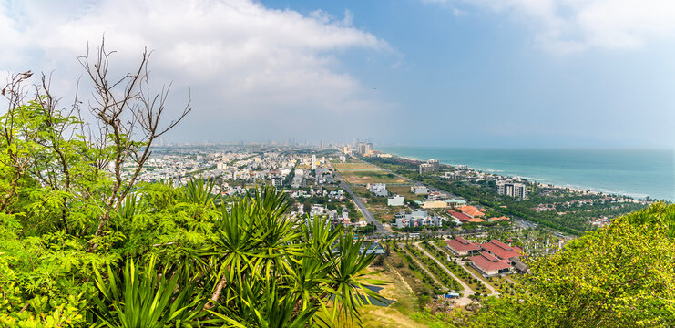 A panorama view down the coastline landscape from the Marble Mountains in Da Nang, Vietnam on a bright sunny day