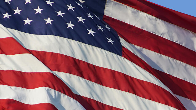 Close Up of American Flag Waving in Sunlight