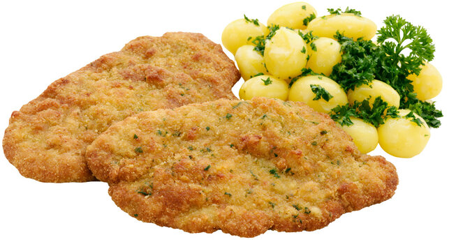 Isolated breaded cutlets and small boiled potatoes with fresh parsley garnish, ready to eat.