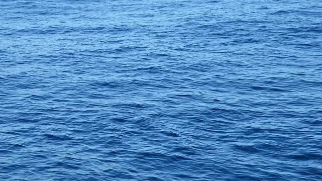 Rippling blue water surface while the boat is moving