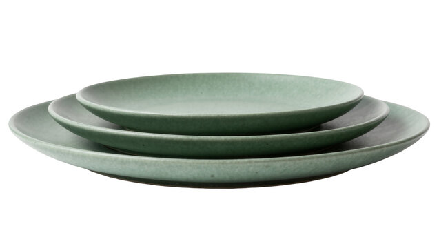 Stack of three matte green ceramic plates, isolated on transparent background