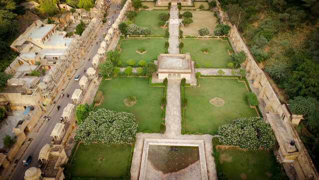 Aerial view of the Sunar Bagh garden featuring manicured lawns, stone pathways, a central pavilion, and historic architecture in Jaipur, Rajasthan, India.