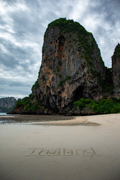 Impressive Limestone Mountain in Krabi with Thailand Written in the Sand