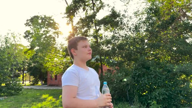 BABY BOY DRINKING WATER AT SUNSET PARK, DRINKING HEALTH REGIMEN, Park bench hydration, Health in nature, Kid cares for body, Nature and sunlight, Water breaks for safety, Fun and water go together