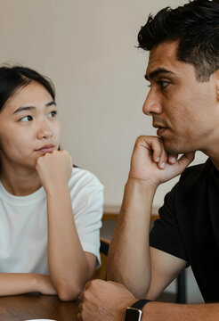 Relationship conflict and communication problems, diverse couple having a serious conversation with tension and misunderstanding in a home environment