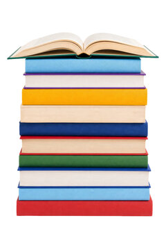 A tall stack of colorful hardcover books with an open volume resting on the very top surface