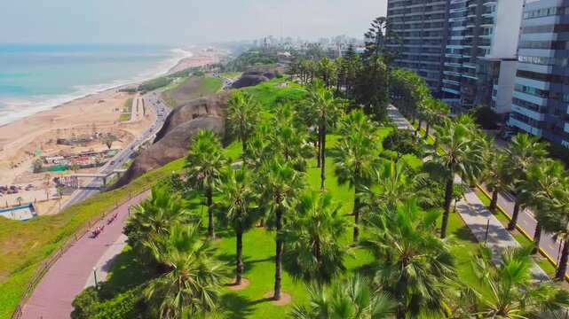 Aerial forward move over Malec&oacute;n de la Marina park in Miraflores facing the ocean
