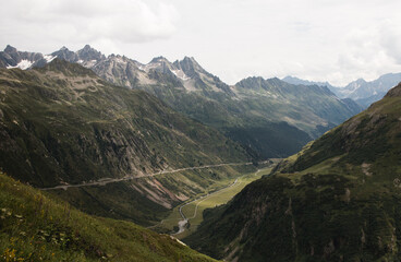 Scenic view over mountain valley with winding glacial river in Swiss Alps © hendrikwolter
