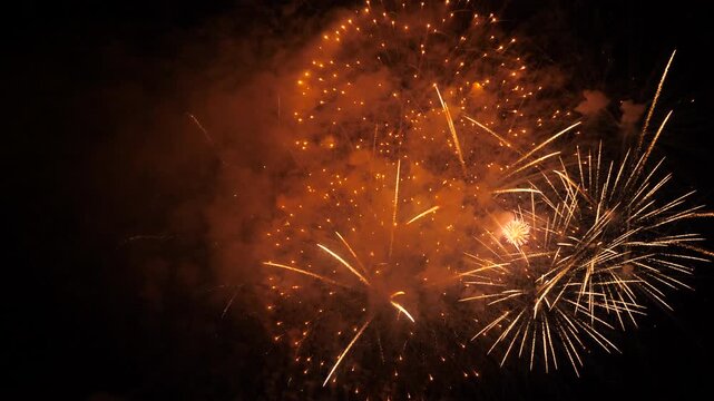 shimmering golden pyrotechnics create unforgettable night for everyone present, fireworks explosion in the night sky, bright explosions create beautiful patterns against the night sky, colorful