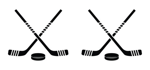 Hockey Game Symbols: Two crossed hockey sticks and two pucks are depicted in a stylized, graphic illustration, symbolizing the sport of ice hockey and its equipment. © Itz Buddha 
