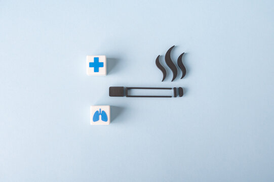 Smoking health risks and lung damage concept with cigarette and medical symbols
