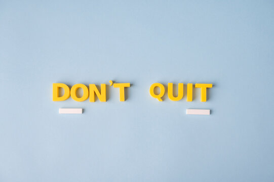 Keep going and never give up motivational message with DON'T QUIT words