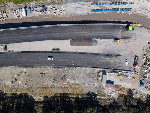 Aerial view of road construction site with asphalt paving machinery and vehicles in progress in Istanbul, Istanbul, Turkiye.