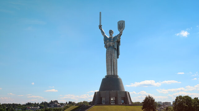 The Motherland Monument in Kyiv, Ukraine. A sunny summer day. The city in the background.