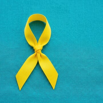 Hopeful Yellow Awareness Ribbon For Cancer Support And Mental Health