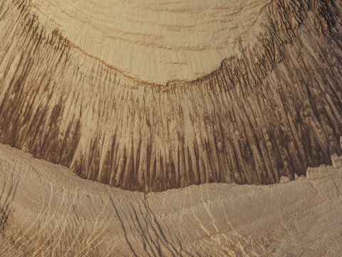Aerial view of intricate erosion patterns and textured slopes.
