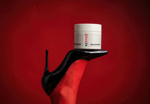 Cream Jar Balanced on Stiletto High Heel Shoe Mockup