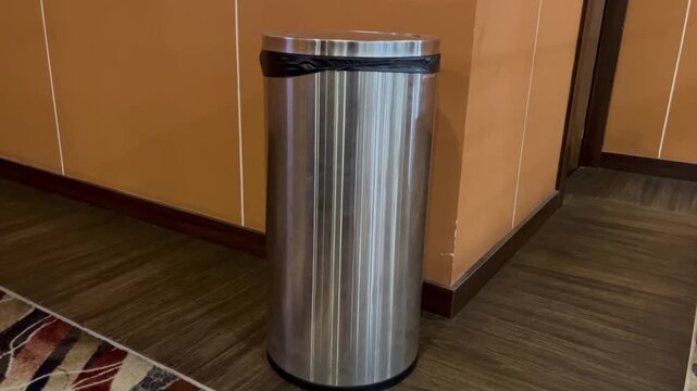 Stainless Steel Trash Can in Hotel Hallway Corner
