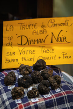 Black Truffles on display at a farmers market in Ventimiglia, Liguria, Italy