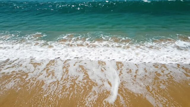 Tropical ocean waves crashing on golden sand beach, relaxing sea shoreline background, water