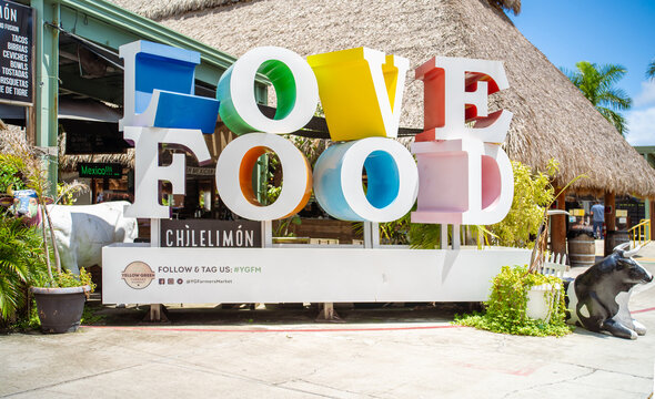 Hollywood, FL, USA - August 30, 2026: A large, colorful LOVE FOOD sign stands outside a local restaurant at Yellow Green Farmers Market.