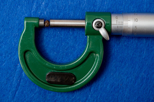 Measurement of the size of a dried peppercorn using a high-precision instrument, a micrometer.