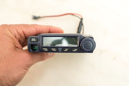 Small CB radio with sideband and female PL plug, safe in hand.