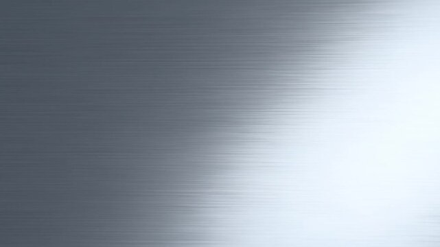 Brushed metal texture with moving light gradient across dark gray reflective surface