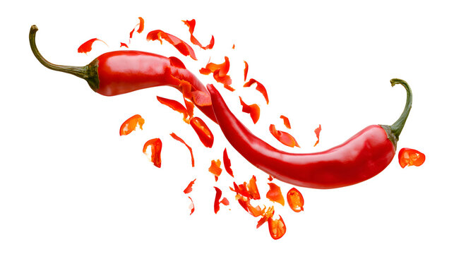 Separated vibrant red chili pepper shards and crisp, spicy slices, dynamically dispersed.
