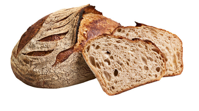 Isolated crusty artisanal sourdough bread loaf, partially sliced, showing airy open crumb texture.
