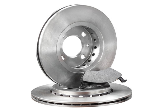 New automotive brake discs and a brake pad isolated on a white background. Essential spare parts for car maintenance, repair, and safety.