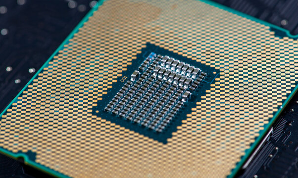 Processor on pcb surface. Circuit board in macro electronics with processor chip. Circuit board for digital computing with processor. Circuitboard as technology background with processor chip.