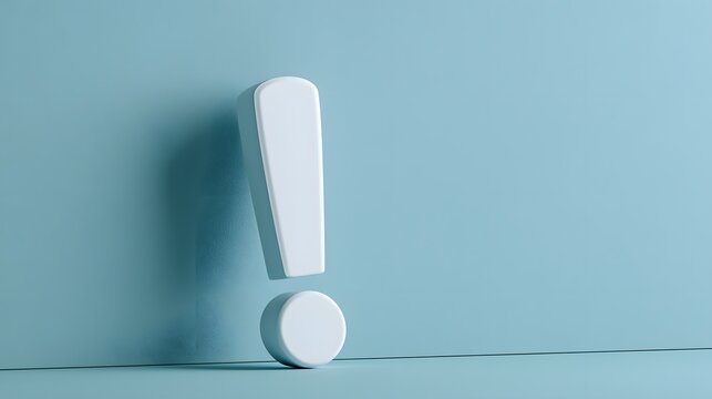A white exclamation mark stands against a soft blue background with soft lighting. This symbol represents concepts of attention, warning, and important information.