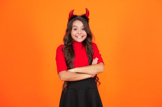 All Hallows party celebration. All Hallows. Funny party devil. Girl devil with Halloween party outfit. Happy Halloween. Excited girl ready for Halloween party isolated on orange. Trick or treat