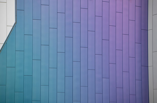 Geometric building design. Modern architecture. Geometric shape. Modern building architecture grey blue color. Architectural geometrical detail. Exterior and wall background