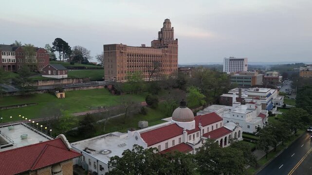 Aerial view of historic buildings and green park in downtown.