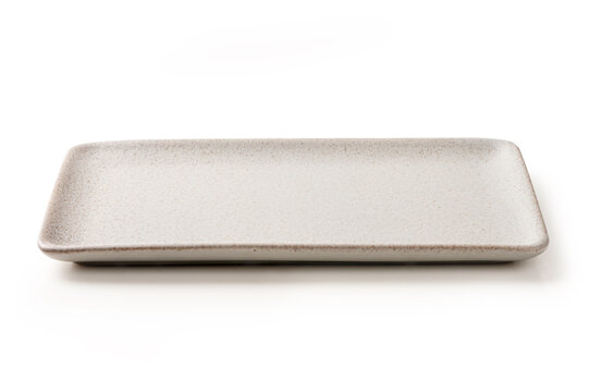 Empty Rectangular Cream White Ceramic Plate , Minimalist and elegant tableware for food styling, isolated on a white background.