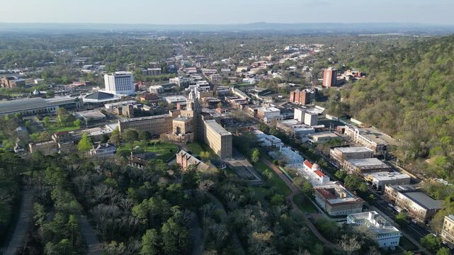 Aerial view of downtown asheville with surrounding forest.