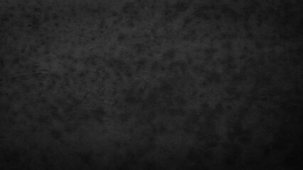 Obraz premium Dark black textured concrete wall background with grunge vignette and mottled pattern. Abstract dark backdrop with rough distressed surface, moody copy space for design.