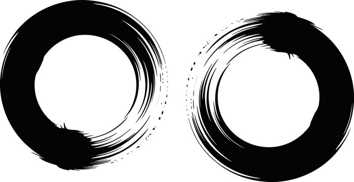 Two black brushstroke enso circles on a white background symbolizing balance and enlightenment