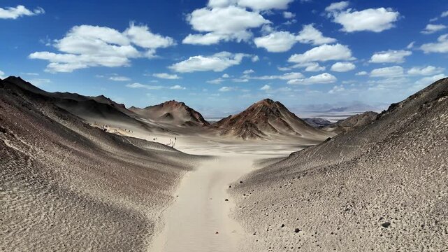 black du mountain gobi desert landscape with rocky mountains and blue sky
