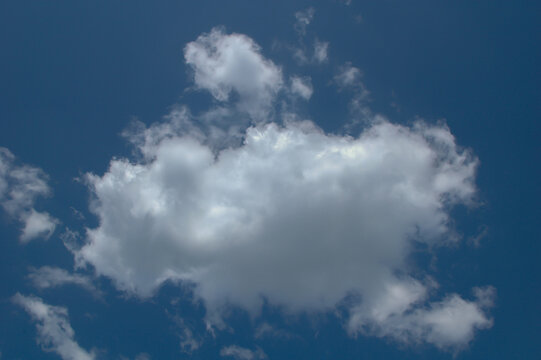 Fluffy White Clouds Against a Bright Blue Sky