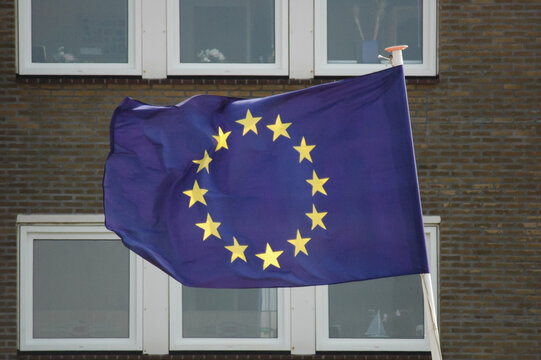 European Union Flag Waving in Urban Setting
